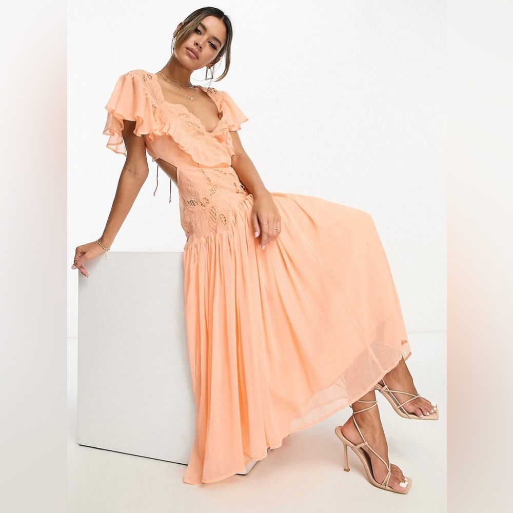 ASOS Design Embroidered cut out midi dress with pephem and frills in peach.